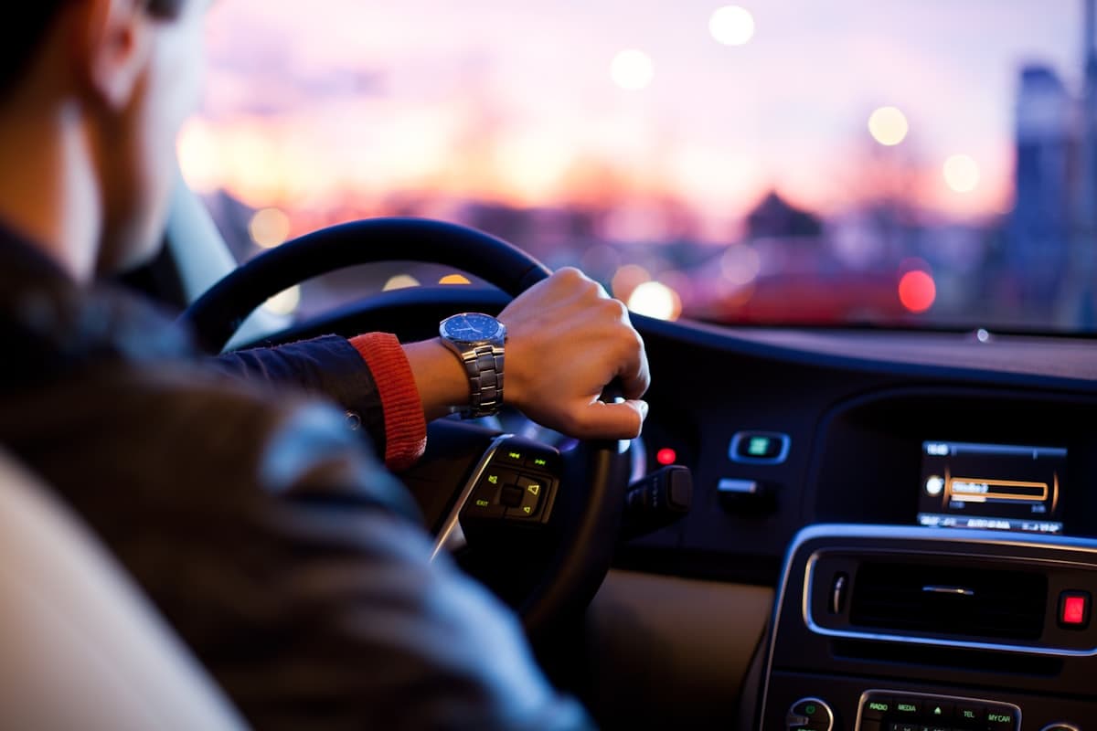 Driver's view through a windshield at dusk on a Dallas roadway